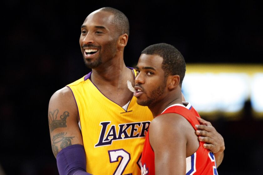 LOS ANGELES, CA - DECEMBER, 19, 2011: Lakers guard Kobe Bryant and Clippers guard Chris Paul.
