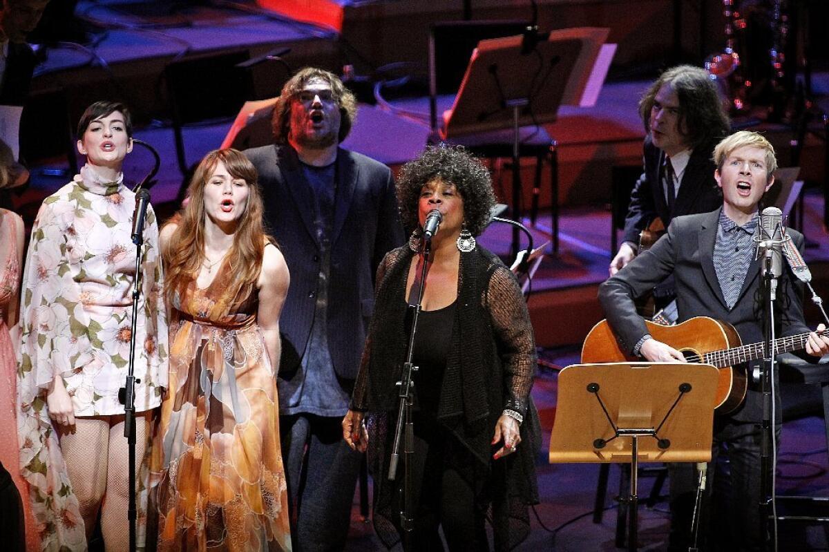 Beck, far right, performs with special guests including Anne Hathaway, left, Jenny Lewis, Jack Black, Merry Clayton and Jon Brion during his "Song Reader" project at Disney Hall in downtown Los Angeles on Sunday.
