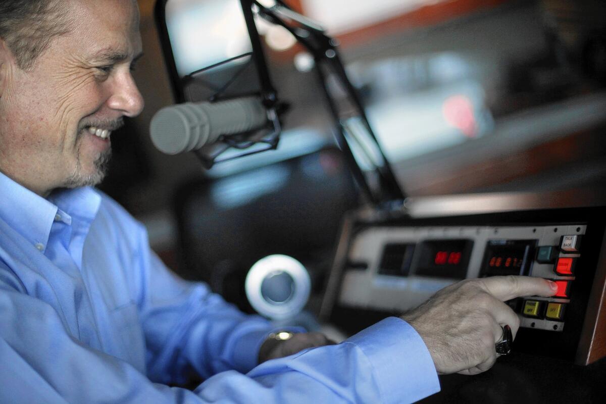 Longtime newscaster Phil Hulett, who hosted his last show for KFWB-AM in August, works at the console in San Pedro where he does his podcast, "Phil Hulett and Friends."
