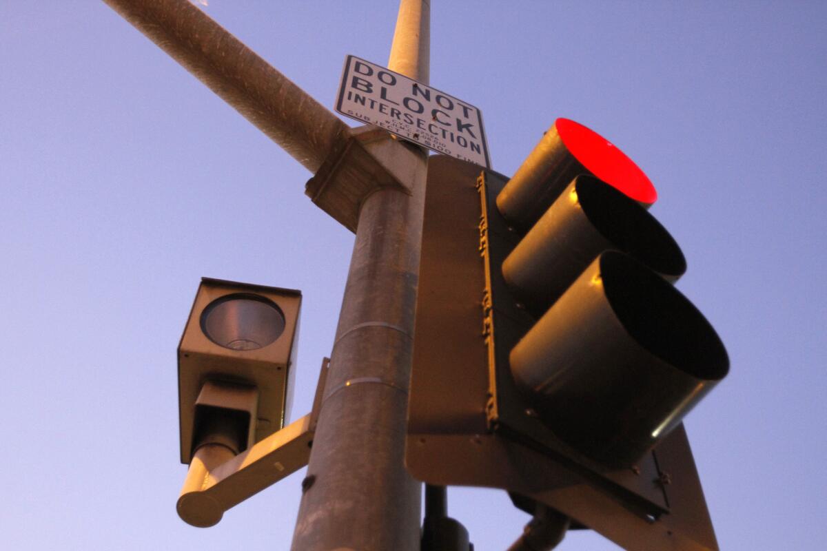 A red light camera is at La Brea Avenue and Santa Monica Boulevard in Los Angeles.