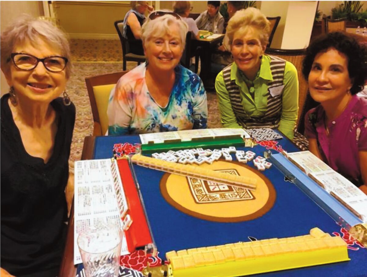 Mah Jonng players ready for a game: Phyllis Ingram, Terry McAnally, Kiki Banks and JoEllyn Trad gather for a weekly La Jolla Newcomers Club activity.