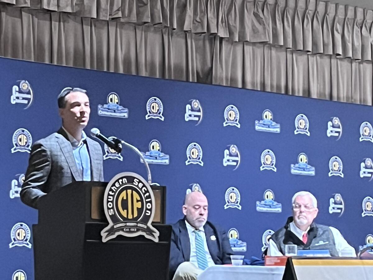 Los Angeles Chargers General Manager Tom Telesco, left, speaks at Monday's CIF Southern Section football press luncheon.