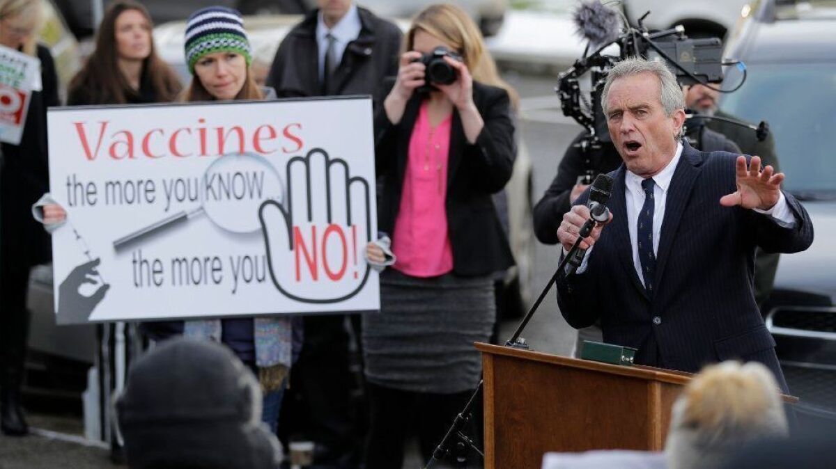 Robert Kennedy Jr. speaks at a rally opposing a bill in Washington state that would remove parents' ability to claim a philosophical exemption to opt their school-age children out of the combined measles, mumps and rubella vaccine, at the Capitol in Olympia, Wash., on Feb. 8.