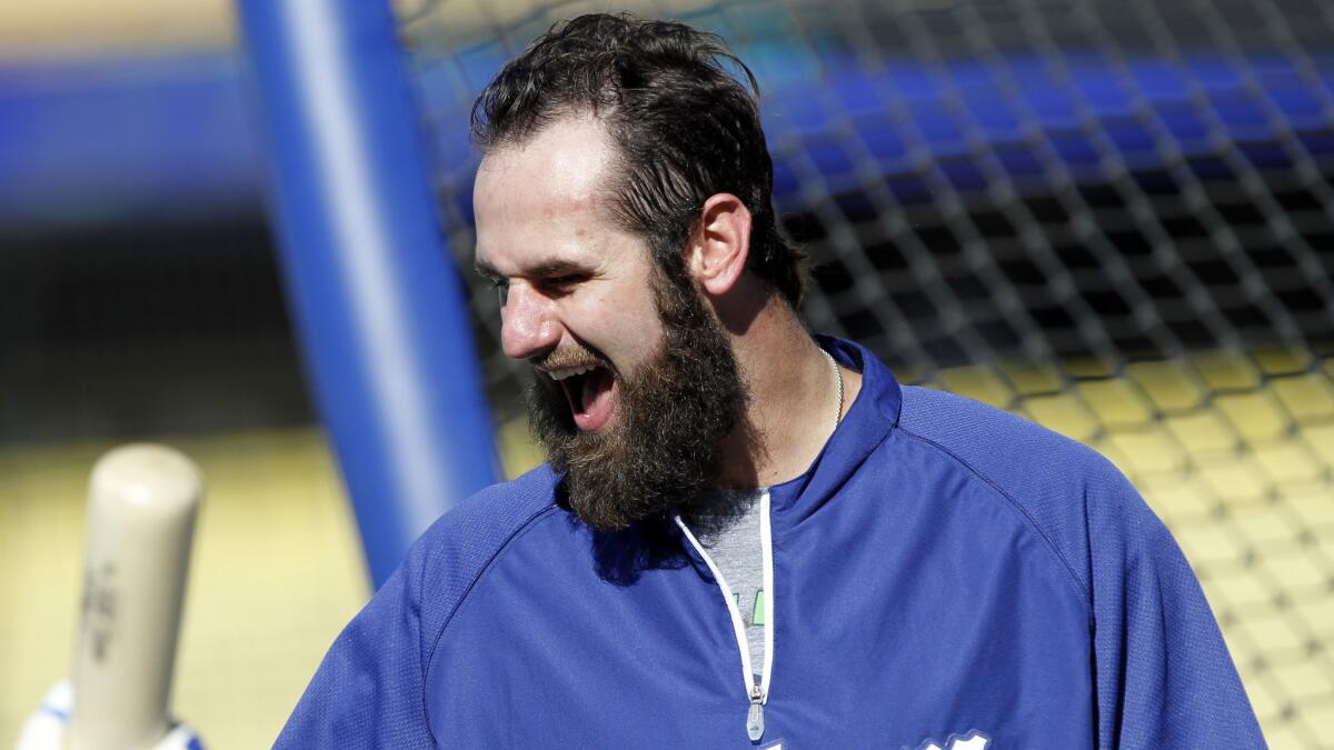 Dodgers outfielder Scott Van Slyke laughs during batting practice before a game against the Chicago White Sox on June 4. Early in his professional career, Van Slyke doubted whether he would be able to make it as a baseball player.
