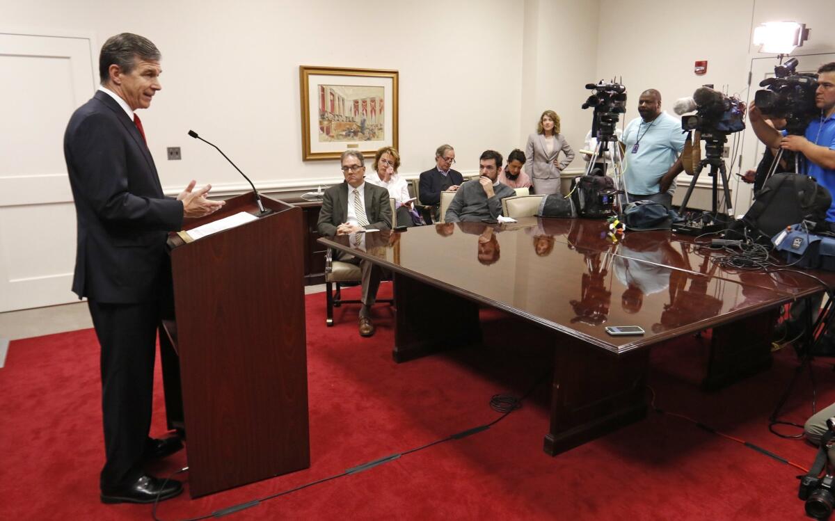 North Carolina Attorney General Roy Cooper speaks at a news conference in his state offices in Raleigh, N.C. on March 29.