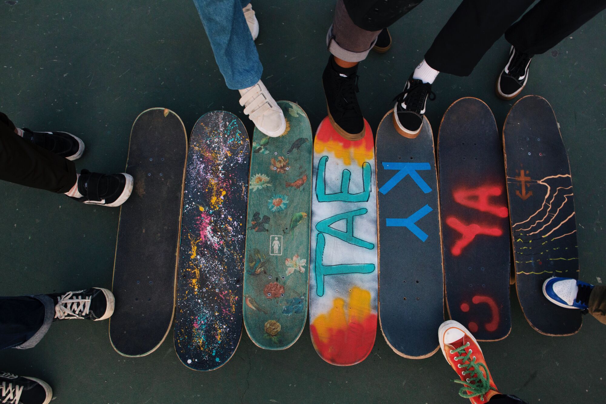 Boos Cruise members line up their skateboards