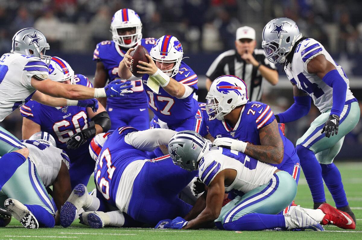 Buffalo Bills quarterback Josh Allen lunges for a first down.