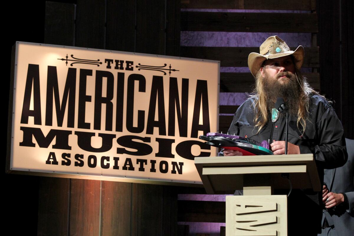 Singer and songwriter Chris Stapleton was named artist of the year on Wednesday in Nashville by the Americana Music Assn. at its 2016 awards ceremony.
