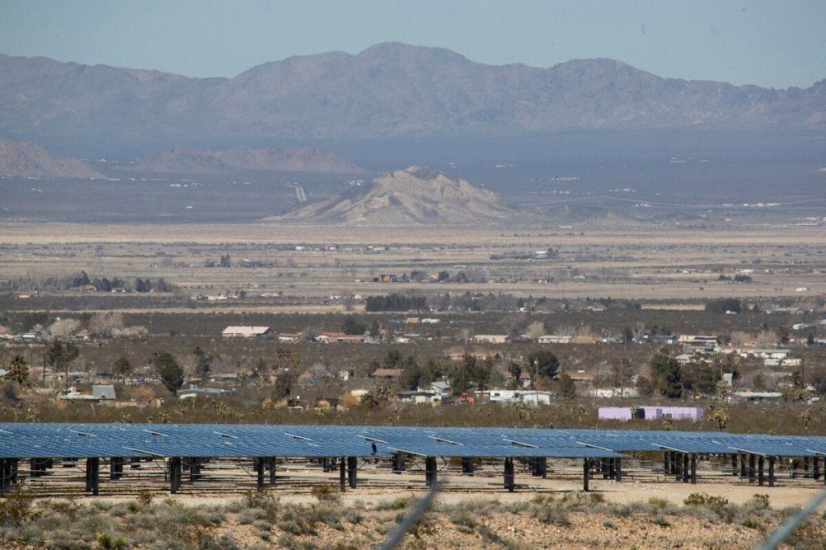 A view of a smaller-scale commercial solar project in the foreground in Lucerne Valley, Calif., on Feb. 25, 2019. A much larger solar project has been proposed for some of the open land in the distance.