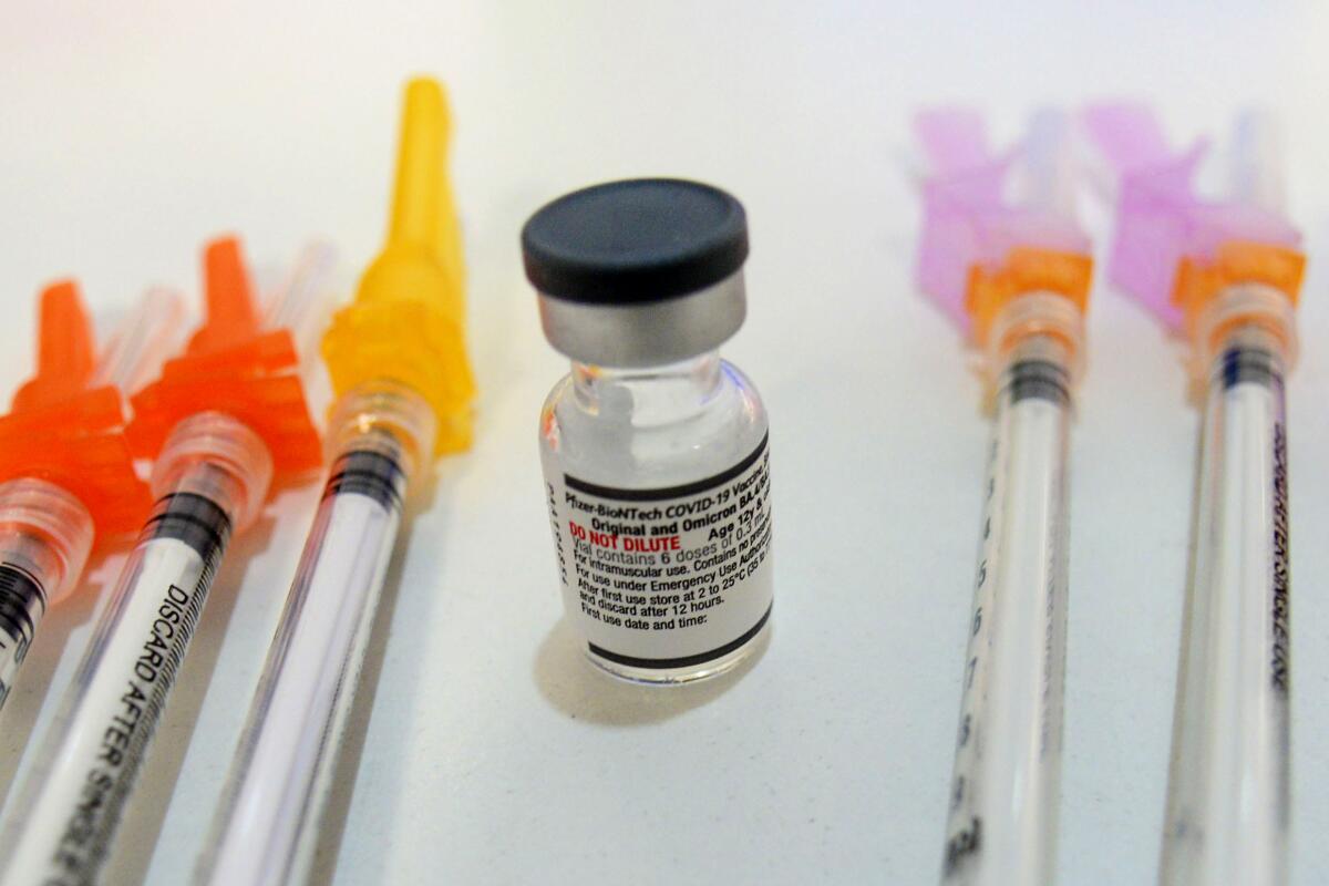 Booster shots of the Pfizer COVID-19 vaccine sit ready to be used at a vaccine clinic in Townshend, Vt.