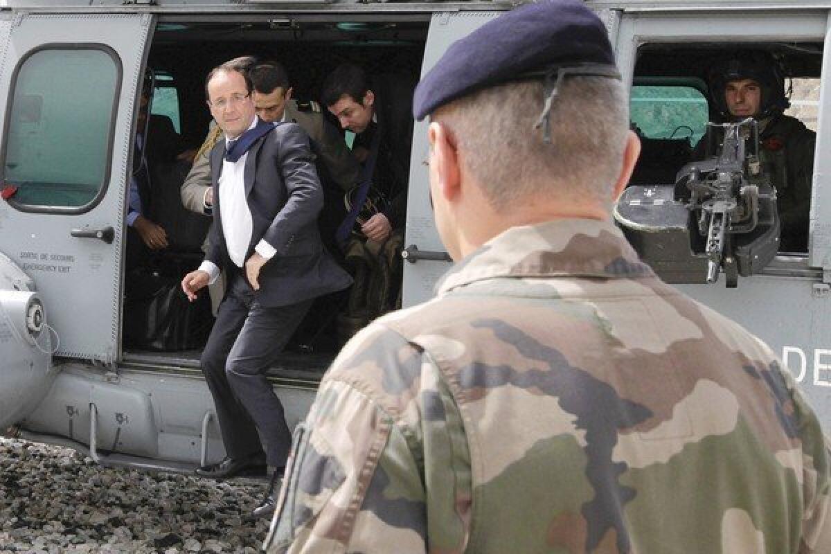French President Francois Hollande arrives Friday at Forward Operating Base Nijrab in Afghanistan's Kapisa province, where most French troops deployed in the country are stationed.