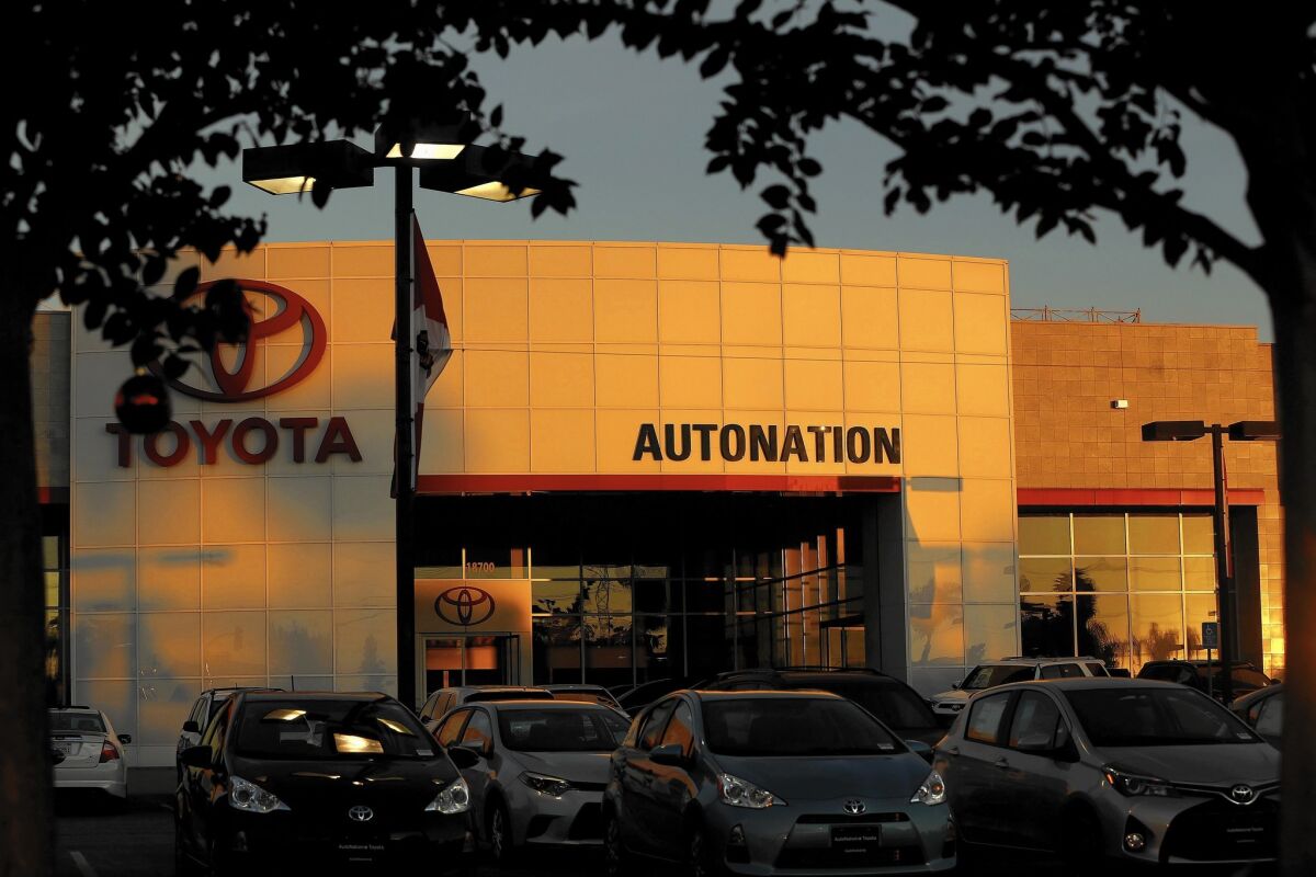 AutoNation's SmartChoice Express digital sales tool will enable customers to research prices that reflect current market values — usually discounted from the sticker price — and put a deposit on a car. Later, the company will offer online bids for trade-ins and arrange auto loans. Above, an AutoNation Toyota store in Cerritos.