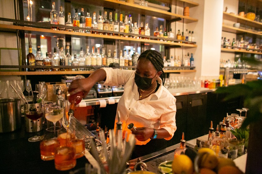 SANTA MONICA, CA - MAY 05: Nicole Mitchell, bartender/server at Cassia, is excited to see the restaurant indoor dining re-opened on Wednesday, May 5, 2021 in Santa Monica, CA. (Jason Armond / Los Angeles Times)