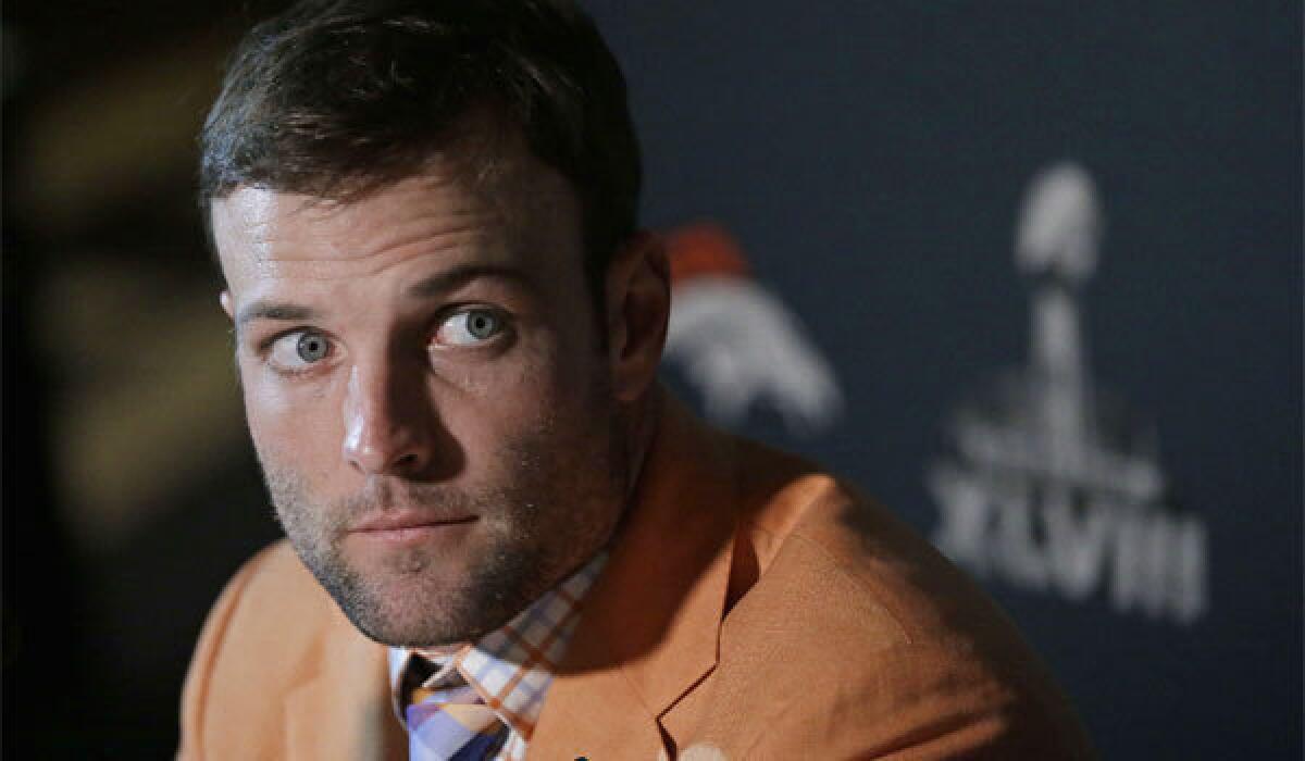 Denver wide receiver Wes Welker listens to a question during a news conference Sunday in Jersey City, N.J.