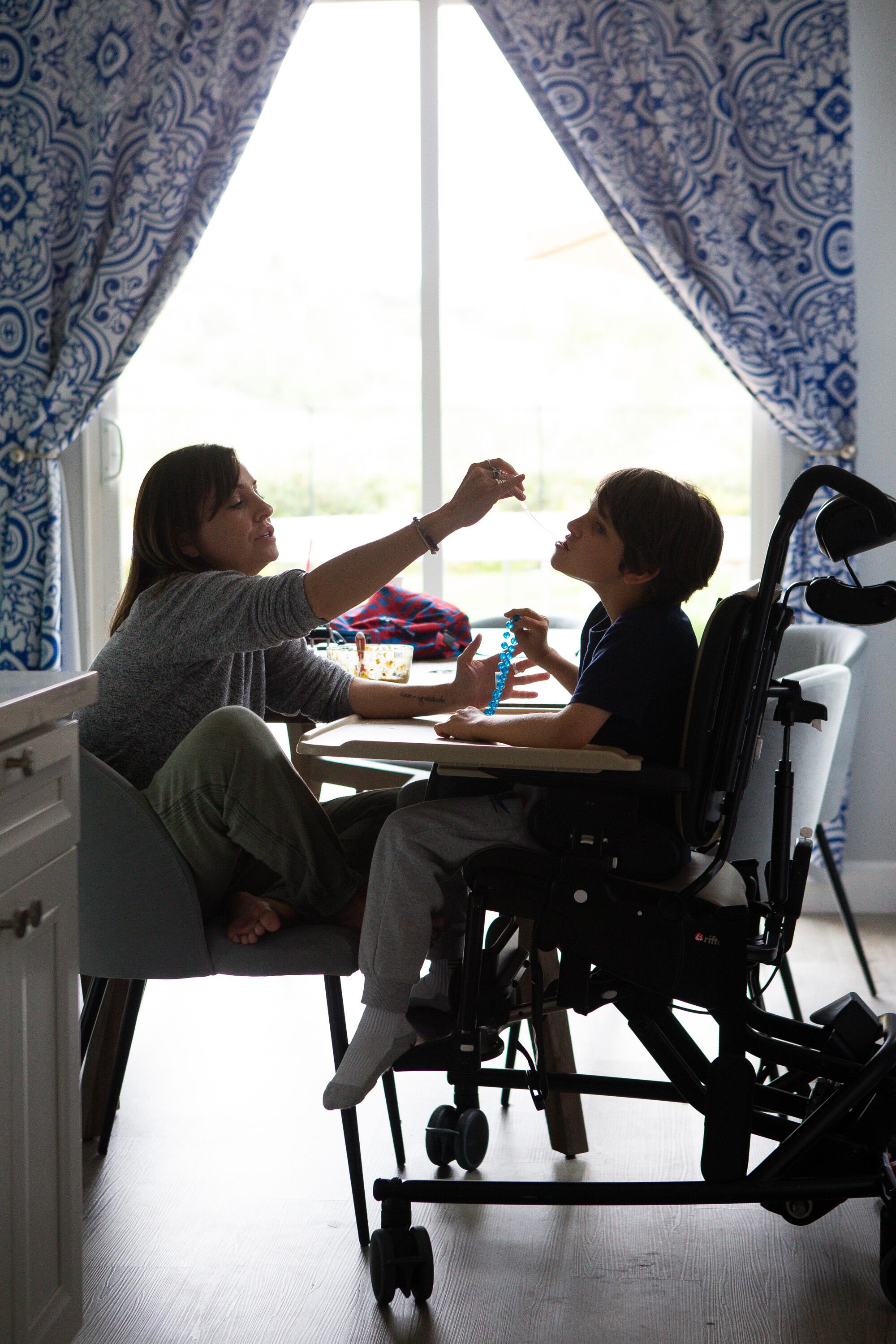 Kelley Dalby feeds her son Connor.