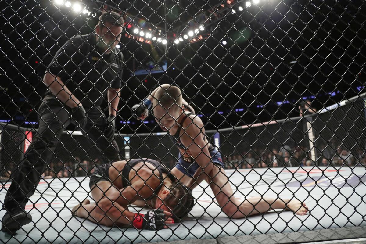 Rose Namajunas has the upper hand against Joanna Jedrzejczyk during a women's strawweight title fight at UFC 217.