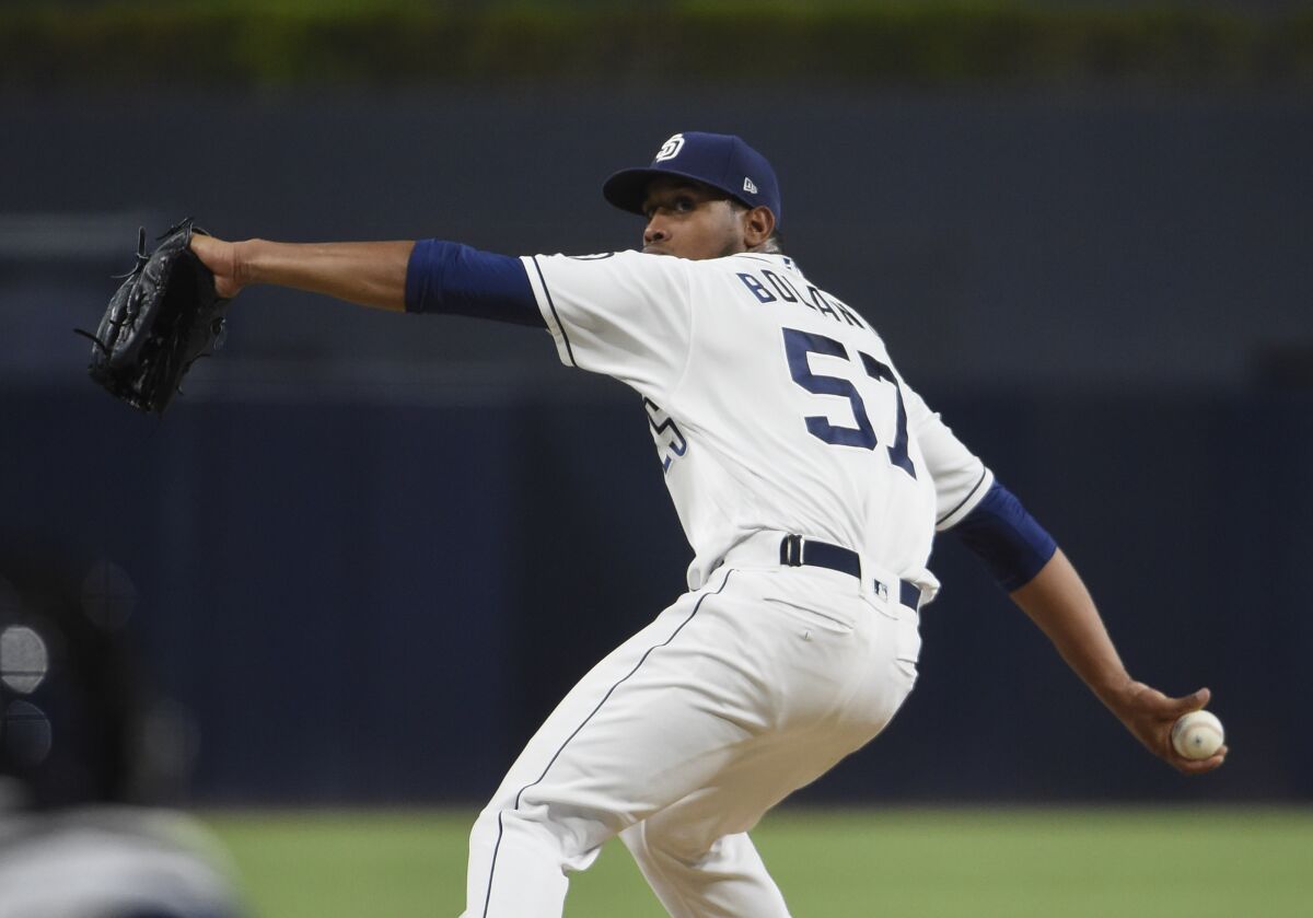 SAN DIEGO, CA - SEPTEMBER 24: Ronald Bolanos #57 of the San Diego Padres pitches during the the first inning of a baseball game against the Los Angeles Dodgers at Petco Park September 24, 2019 in San Diego, California. (Photo by Denis Poroy/Getty Images)