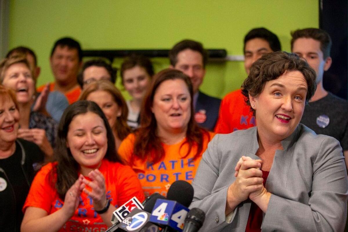 Katie Porter with volunteers at her first news conference after being declared the winner in the 45th Congressional District over Rep. Mimi Walters.