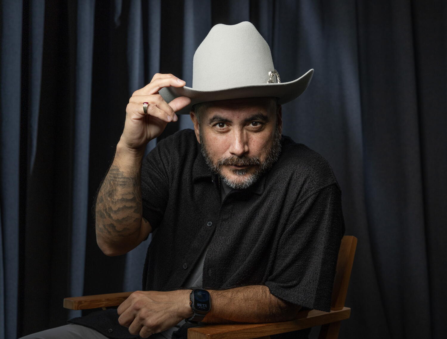 Image from linked report: With 10 cats and a cowboy hat, Alfred Robles is building his comedy career