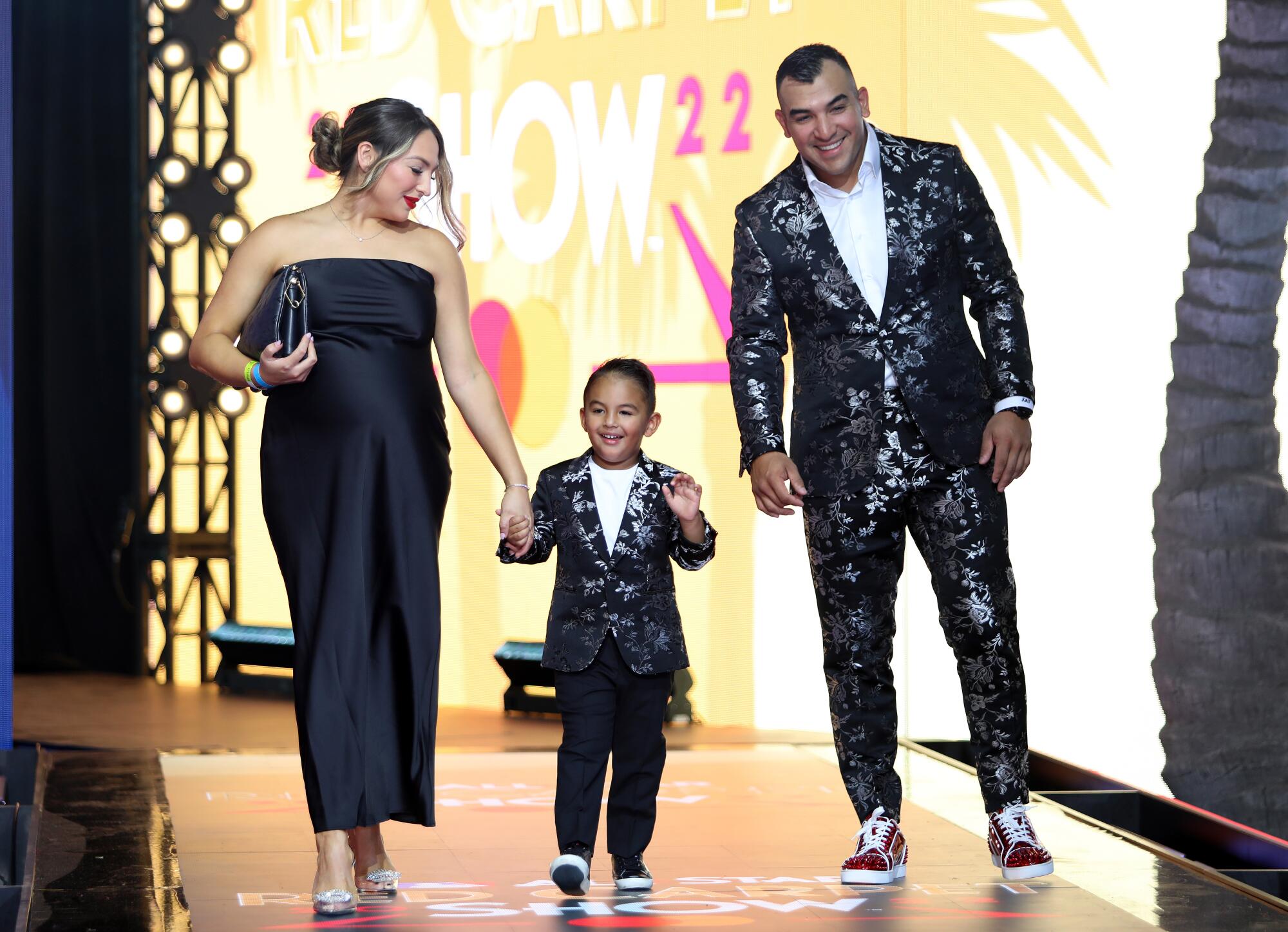 Jose Trevino in a black suit with silver designs and family arrive at the 2022 MLB All-Star Game Red Carpet Show.