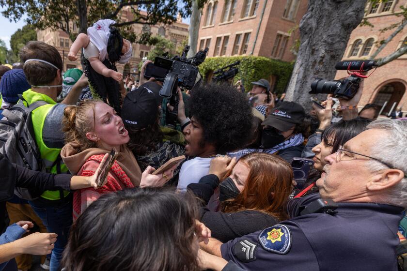 April 24: Public safety officers confront pro-Palestinian demonstrators on the USC campus on April 24, 2024 