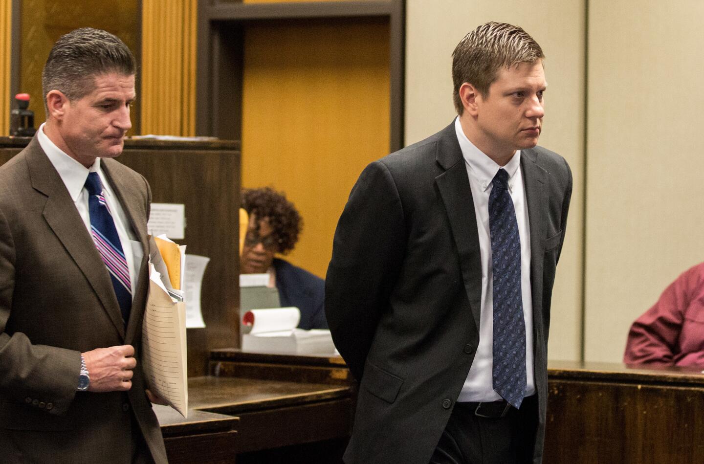 Chicago police Officer Jason Van Dyke, right, attends a court hearing with his attorney, Daniel Herbert, on Dec. 18, 2015, at the Leighton Criminal Court Building in Chicago. Van Dyke is charged with first-degree murder in the 2014 fatal shooting of Laquan McDonald, 17, while Van Dyke was on duty.
