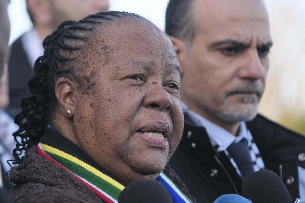 FILE - South Africa's Foreign Minister Naledi Pandor addresses reporters after session of the International Court of Justice, or World Court, in The Hague, Netherlands, Friday, Jan. 26, 2024. South Africas foreign minister says her countrys citizens who fight in the Israeli armed forces or alongside them in Gaza will be arrested when they return home. (AP Photo/Patrick Post, File)