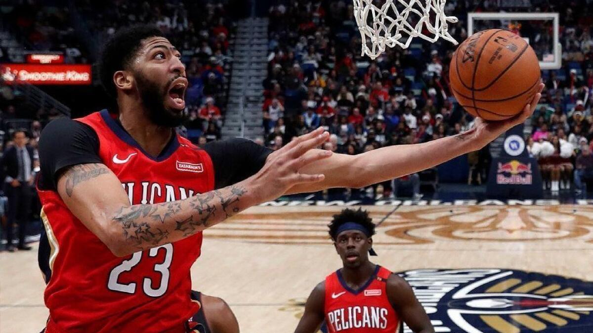 Pelicans forward Anthony Davis puts up a shot during a game against the Heat.
