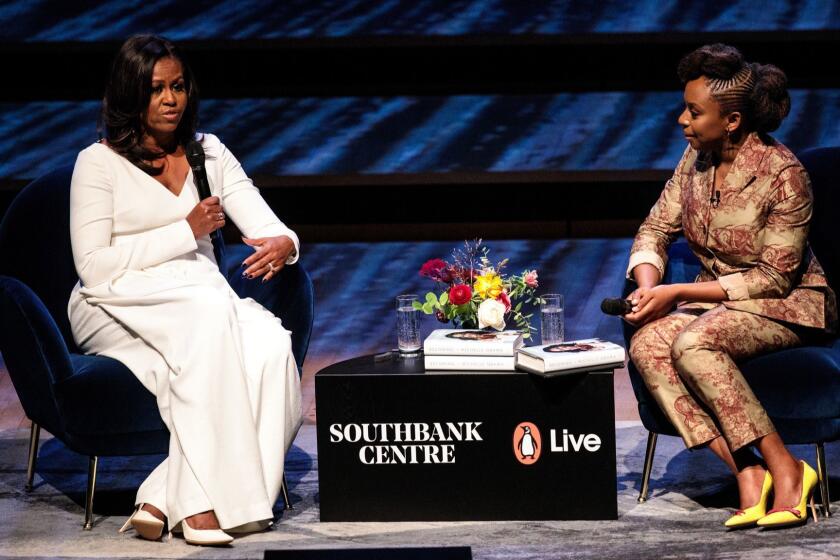 LONDON, ENGLAND - DECEMBER 03: Former U.S. First Lady Michelle Obama speaks with Nigerian author Chimamanda Ngozi Adichie at The Royal Festival Hall on December 03, 2018 in London, England. The former First Lady's memoir titled 'Becoming' has become the best selling book in the US for 2018 according to figures released by her publisher Penguin Random House. (Photo by Jack Taylor/Getty Images) ** OUTS - ELSENT, FPG, CM - OUTS * NM, PH, VA if sourced by CT, LA or MoD **