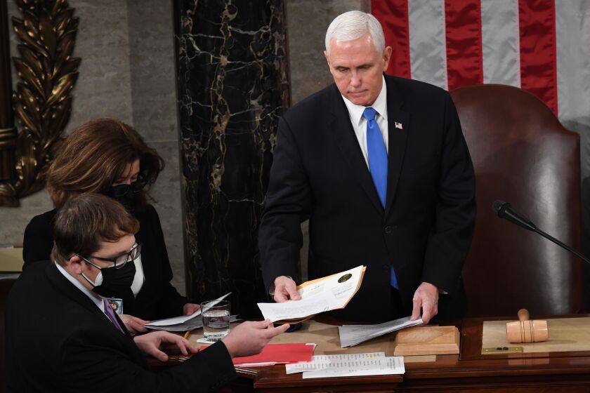 WASHINGTON, DC - JANUARY 06: U.S. Vice President Mike Pence presides over a joint session of Congress on January 06, 2021 in Washington, DC. Congress held a joint session today to ratify President-elect Joe Biden's 306-232 Electoral College win over President Donald Trump. A group of Republican senators said they would reject the Electoral College votes of several states unless Congress appointed a commission to audit the election results. (Photo by Saul Loeb - Pool/Getty Images)