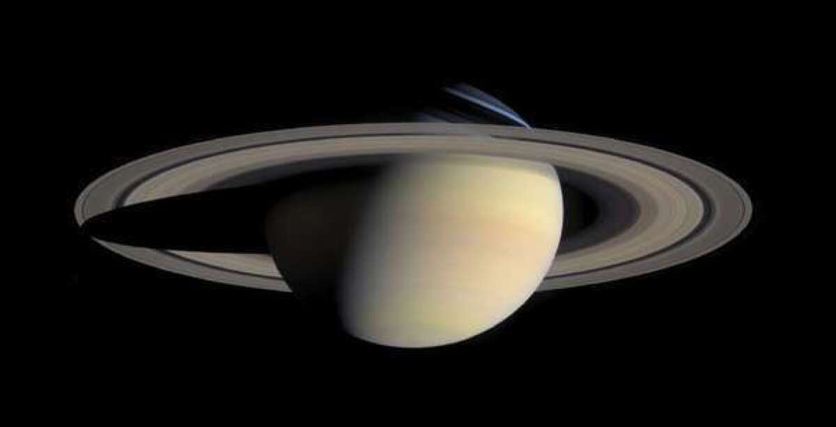This photo taken by the Cassini Saturn Probe on Oct. 6, 2004, shows the planet Saturn and its rings. A detailed analysis of the spacecraft data finds the rings and moons are abundant in water ice, and that the moon Prometheus may have arisen from the planet's rings.