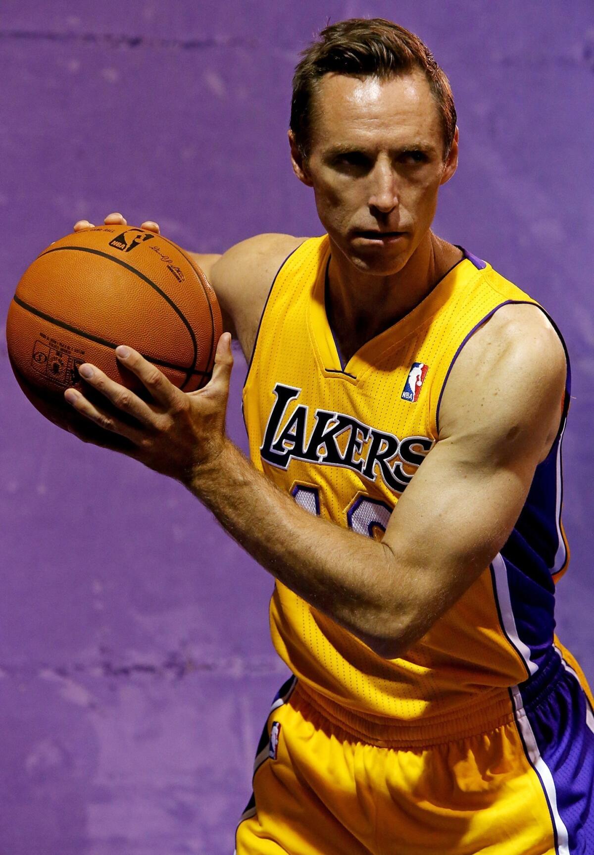 Guard Steve Nash poses for pictures during the Lakers' media day at the team's training facility in El Segundo on Saturday.