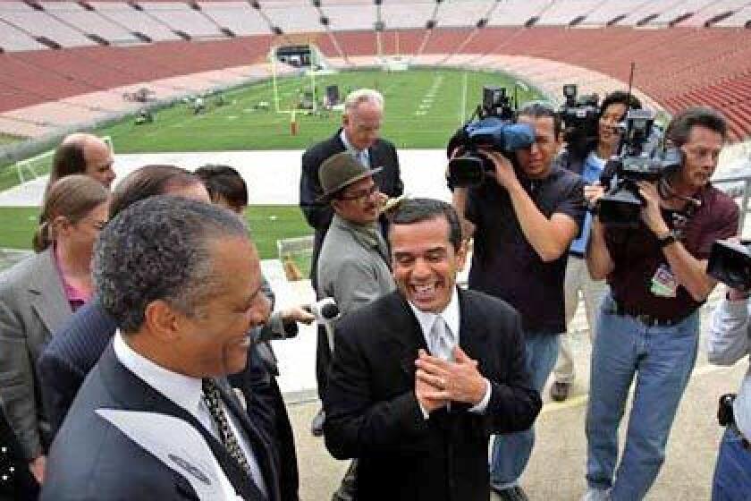 In April of 2006, Mayor Antonio Villaraigosa, center, Councilman Bernard Parks, left, and members of the Coliseum Commission toured the stadium and gave a news conference to discuss a presentation to the National Football League and stadium improvements.