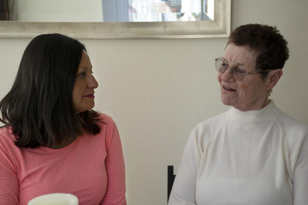 Starr Diaz-Murphy (left) and her mother Socorro Diaz discuss their history of caregiving for one another in their Chula Vista home on Wednesday, Oct. 30, 2019.