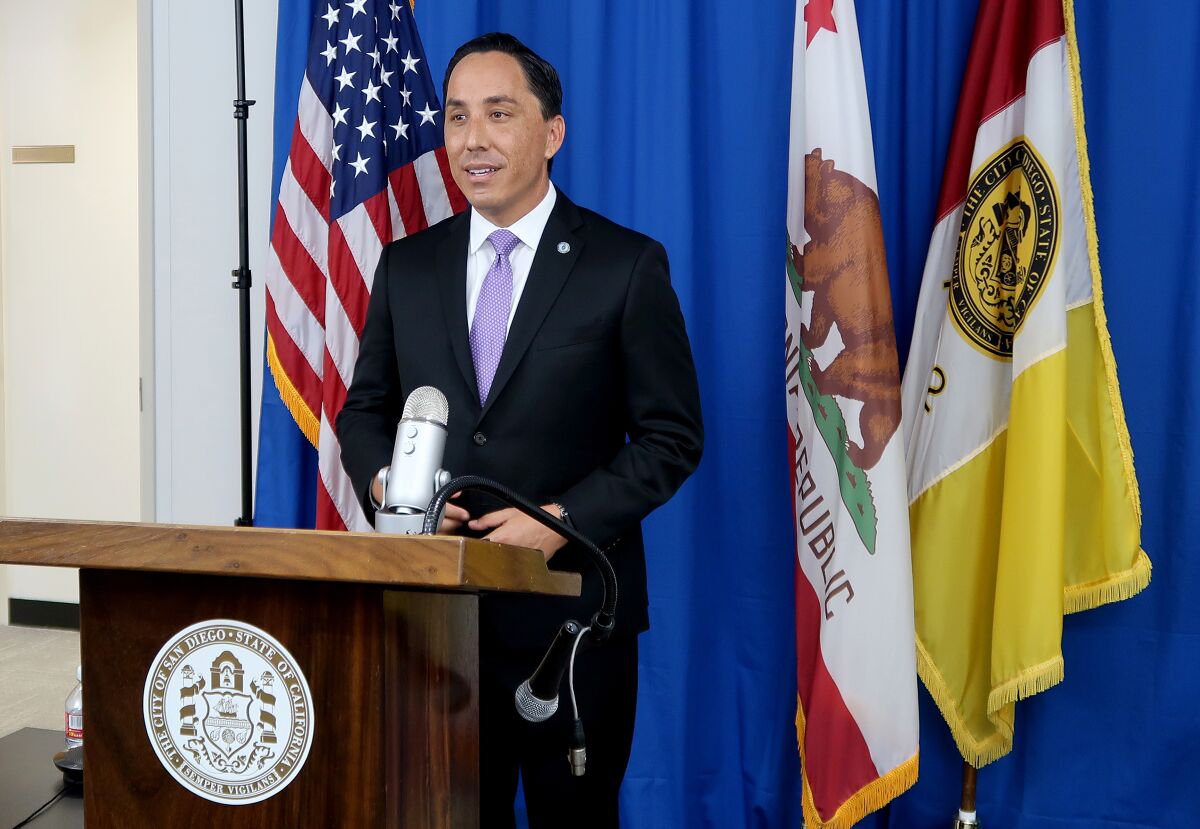Todd Gloria, San Diego's new mayor, replaced termed-out Mayor Kevin Faulconer, left, in online ceremony