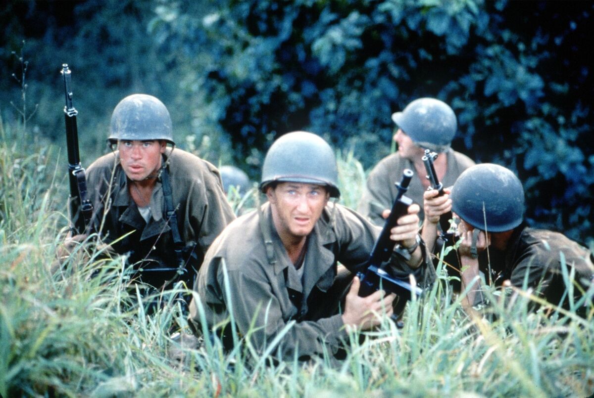 After a 20-year absence, writer-director Terrence Malick returned to filmmaking with WWII epic "The Thin Red Line," boasting a huge cast of stars, including Sean Penn (center). It was nominated for seven Oscars, including best picture.