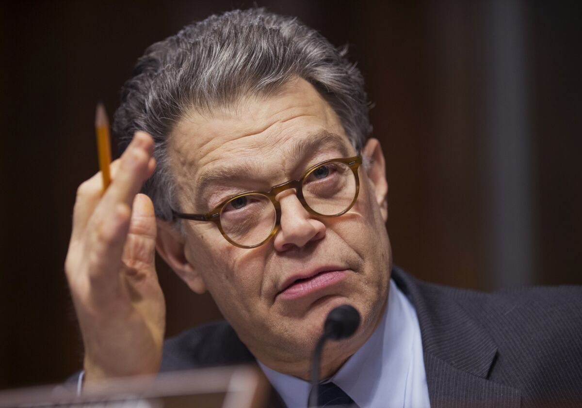 Former Sen. Al Franken questions a panel of witnesses during a hearing on Capitol Hill.