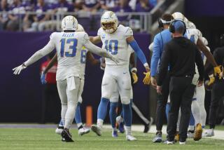 Chargers quarterback Justin Herbert (10) celebrates with receiver Keenan Allen.