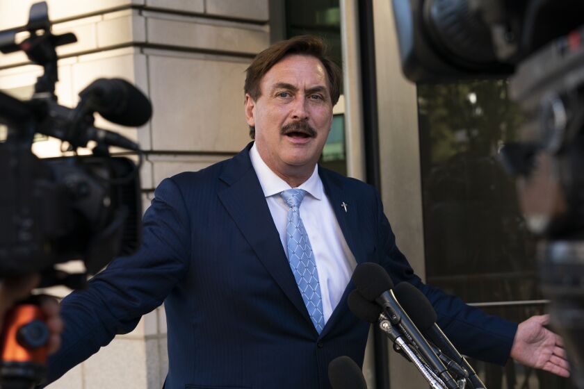 FILE - MyPillow chief executive Mike Lindell, speaks to reporters outside federal court in Washington, June 24, 2021. Lindell, who has organized or attended forums around the U.S. peddling conspiracy theories about voting machines, said earlier this week that he had received a subpoena from a federal grand jury investigating the breach in Colorado and was ordered to hand over his cell phone to FBI agents who approached him at a fast-food restaurant in Minnesota. (AP Photo/Manuel Balce Ceneta, File)