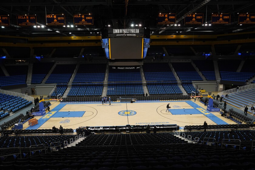 An empty Pauley Pavilion is seen before an NCAA college basketball game between UCLA and Alabama State Wednesday, Dec. 15, 2021, in Los Angeles. The game will not be played due to COVID-19 protocols. (AP Photo/Marcio Jose Sanchez)