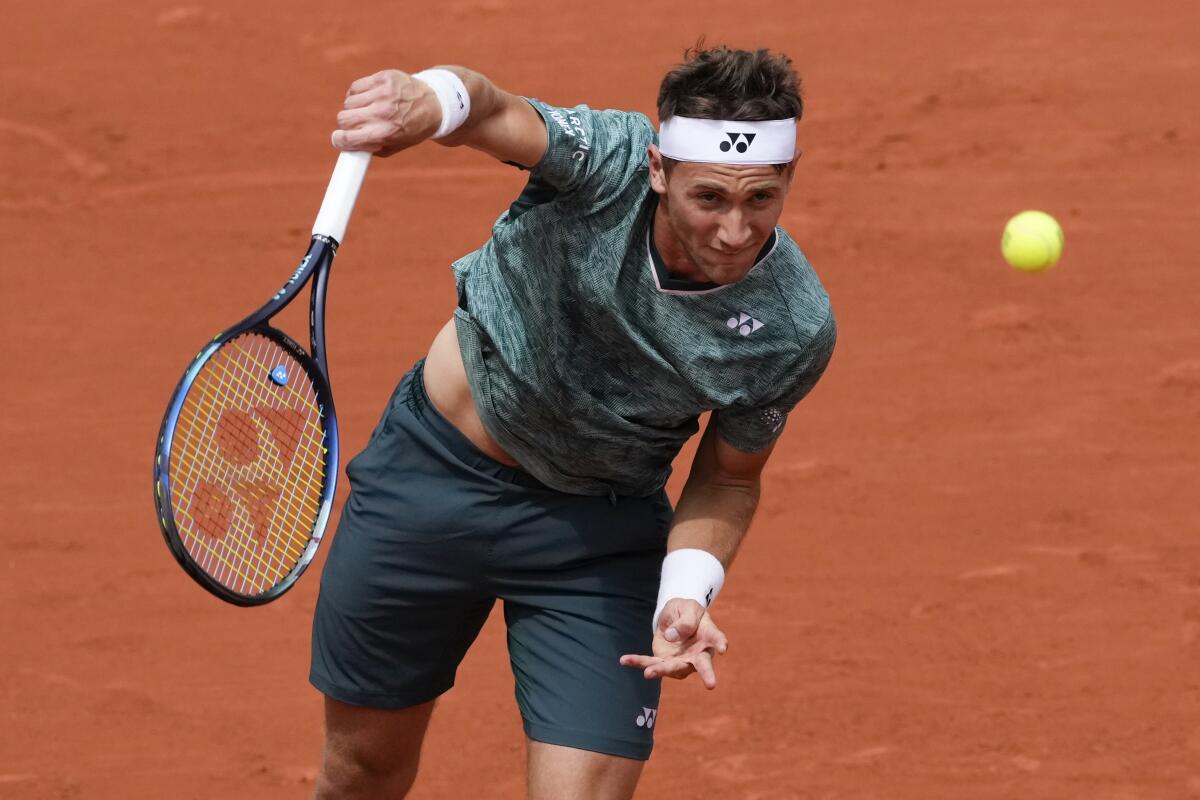 Casper Ruud serves the ball at the French Open.