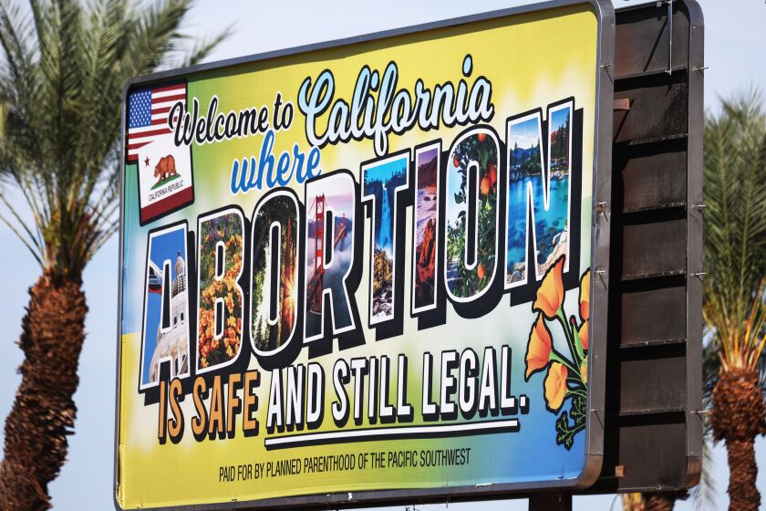 RANCHO MIRAGE, CALIFORNIA - JULY 12: A billboard reads, 'Welcome to California where abortion is safe and still legal' on July 12, 2022 in Rancho Mirage, California. The billboard was paid for by Planned Parenthood of the Pacific Southwest. The number of patients from outside states increased 900 percent at Planned Parenthood clinics in San Bernardino and Orange counties the week following the Supreme Court's decision in the Dobbs v Jackson Women's Health case. The decision overturned the landmark 50-year-old Roe v Wade case and erased a federal right to an abortion. (Photo by Mario Tama/Getty Images)