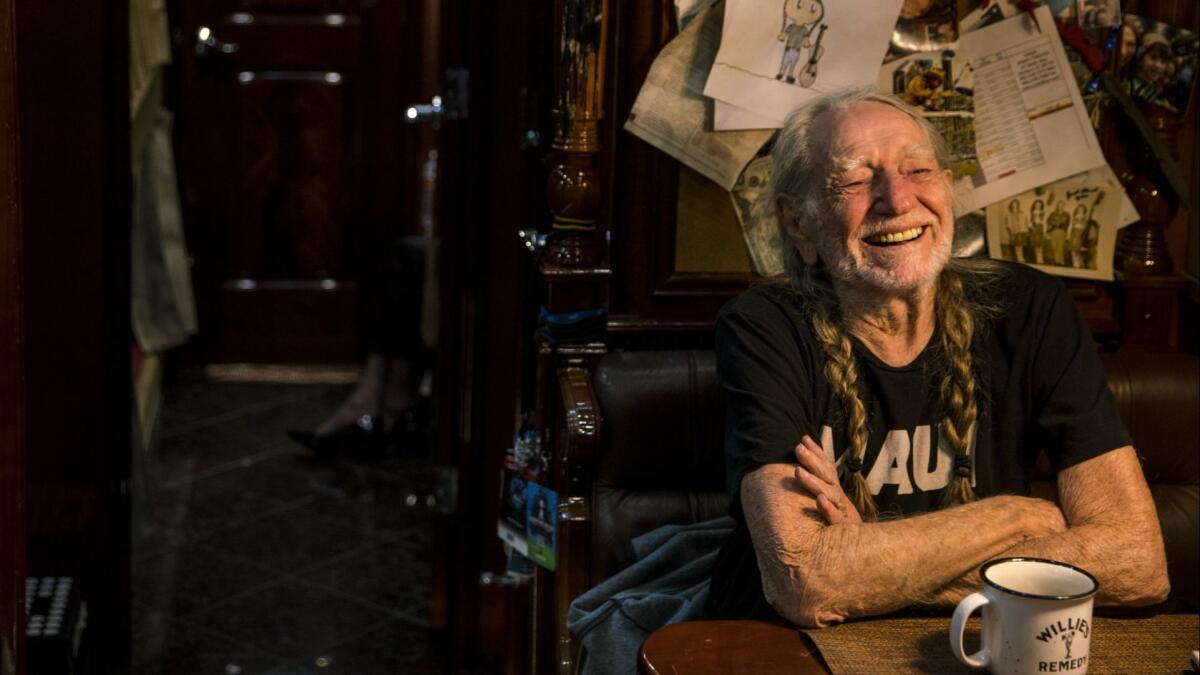 Veteran country music star Willie Nelson, photographed on his tour bus in October during a stop in Hollywood, was saluted Wednesday by the Producers & Engineers Wing of the Recording Academy, part of annual Grammy Week festivities.
