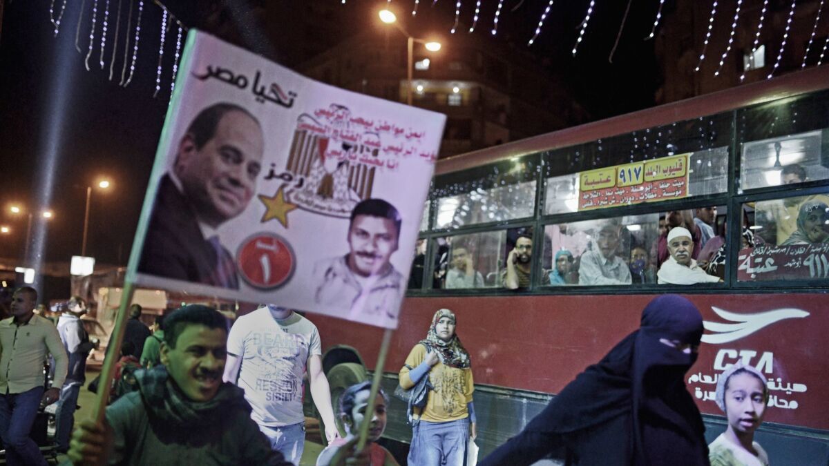 Supporters of Egypt's incumbent president, Abdel Fattah Sisi, head to a political gathering in Cairo's working-class district of Shubra on March 21, 2018.