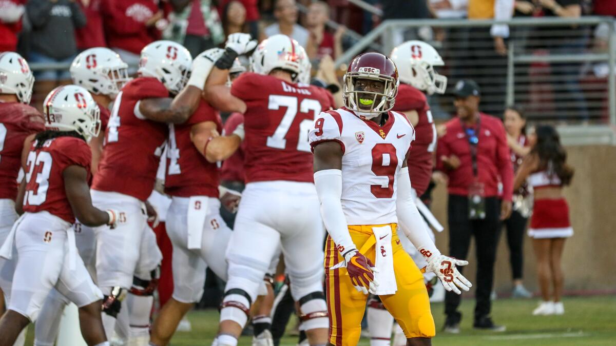 USC cornerback Greg Johnson looks on as Stanford celebrates scoring a touchdown at the end of the second quarter.