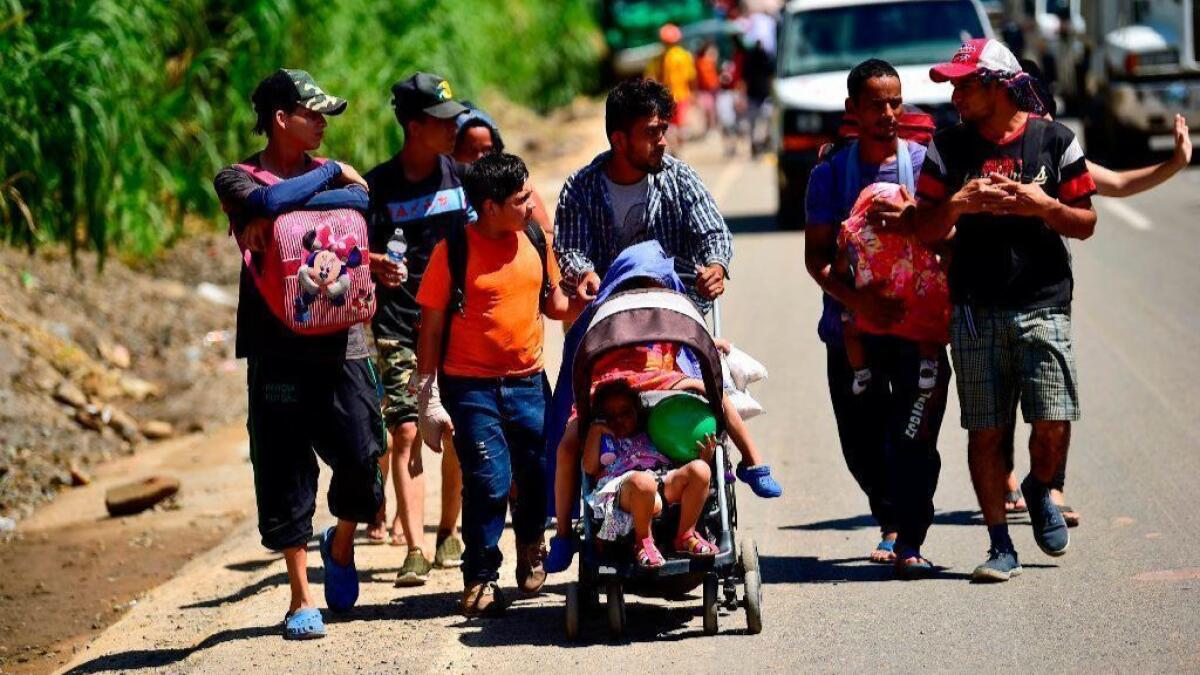 Honduran migrants traveling through Mexico's Chiapas state take part in a caravan heading to the United States on Oct. 22.