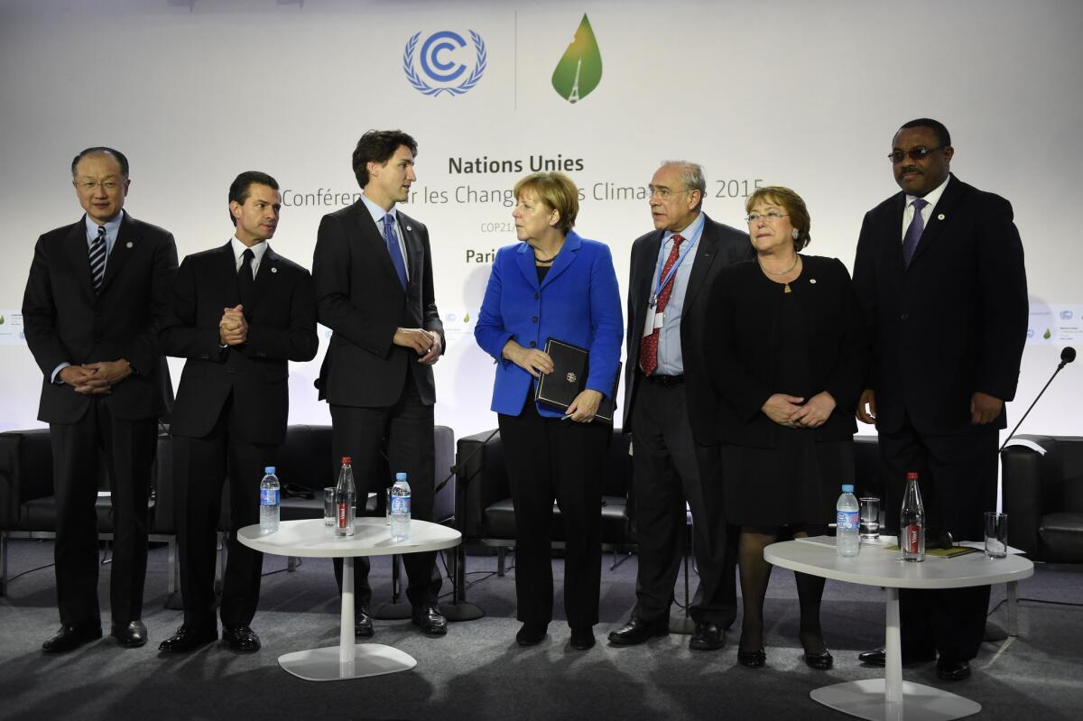 (From L) World Bank Group President Jim Yong Kim, Mexican President Enrique Pena Nieto, Canadian Prime Minister Justin Trudeau, German Chancellor Angela Merkel, OECD president Angel Gurria, Chilean President Michelle Bachelet and Ethiopian Prime Minister Hailemariam Desalegn attend the Heads of State media event on carbon pricing, as part of the COP21 United Nations conference on climate change in Le Bourget on the outskirts of the French capital Paris on November 30, 2015. More than 150 world leaders are meeting under heightened security, for the 21st Session of the Conference of the Parties to the United Nations Framework Convention on Climate Change (COP21/CMP11), also known as "Paris 2015" from November 30 to December 11. AFP PHOTO / ERIC FEFERBERGERIC FEFERBERG/AFP/Getty Images ** OUTS - ELSENT, FPG, CM - OUTS * NM, PH, VA if sourced by CT, LA or MoD **