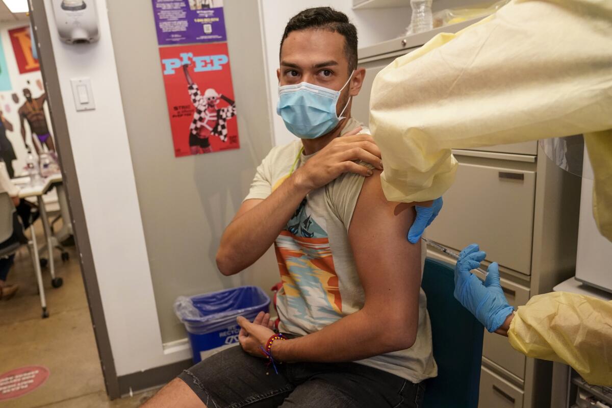 A patient is inoculated with the monkeypox vaccine during a vaccination clinic at the OASIS Wellness Center.