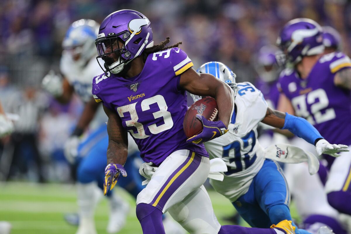 Vikings running back Dalvin Cook carries the ball against the Lions on Dec. 8, 2019.