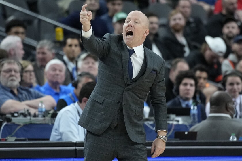 UCLA head coach Mick Cronin motions towards the court during the second half of an NCAA college basketball game against Southern California in the semifinal round of the Pac-12 tournament Friday, March 11, 2022, in Las Vegas. (AP Photo/John Locher)
